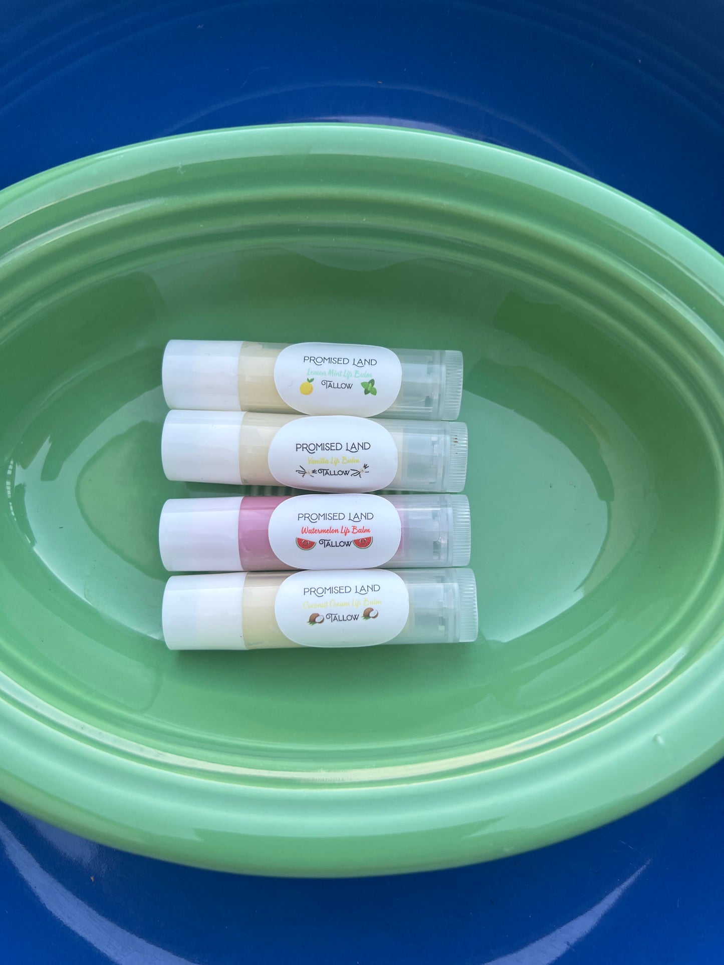Our tallow lip balm in lip balm tubes in coconut, watermelon, vanilla and lemon mint flavors.