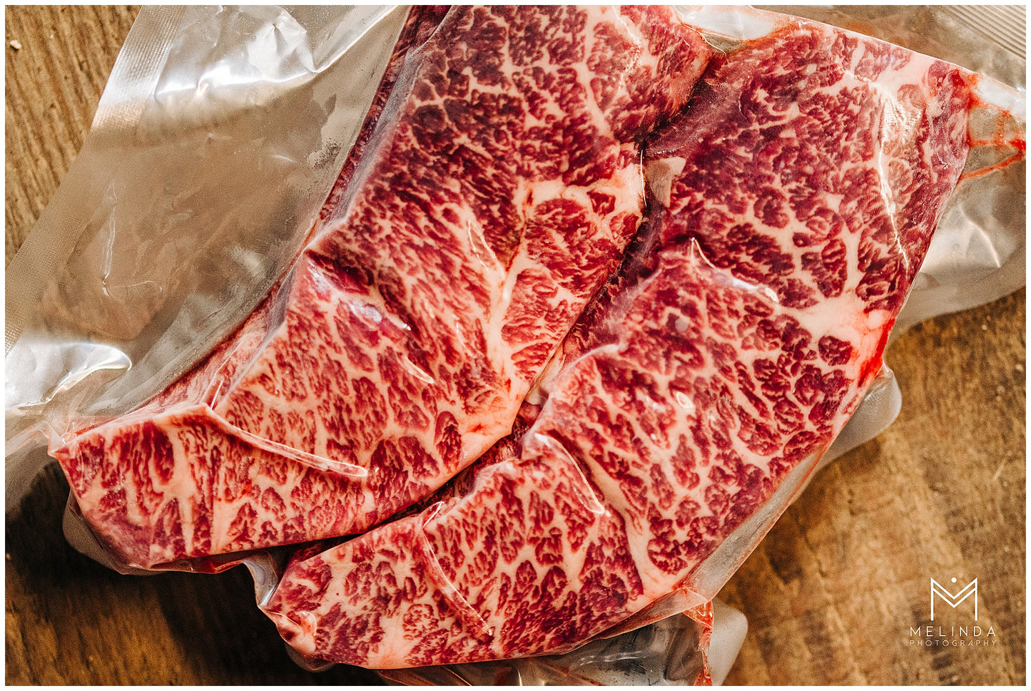 Close-up of a tender, juicy farm-raised Denver Steak, perfectly marbled with rich, flavorful cuts, ready for grilling or cooking.